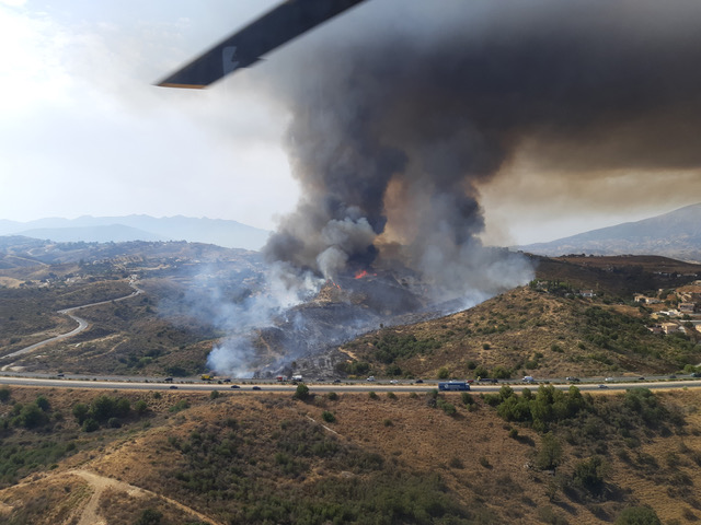 “In the past, more fires were started deliberately, especially by developers wanting to build in forest areas — but the law has fortunately changed.” Forest fire by Highway AP-7 near Costa del Sol. Photo © Isa Moreno/INFOCA